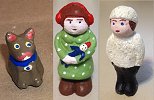 Three putz figures that were molded by contributors to Cardboard Christmas' forums.