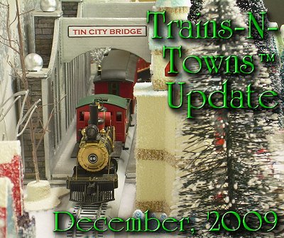 The official e-newsletter of Big Indoor Trains<sup><small>TM</small></sup> and Big Christmas Trains<sup><small>TM</small></sup>. This is Howard Lamey's 'Tin City' bridge with an On30 train manufactured by Bachmann.  The bridge was a project in Click to see a larger image.