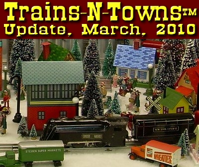 The official e-newsletter of Big Indoor Trains<sup><small>TM</small></sup> and Big Christmas Trains<sup><small>TM</small></sup>. This is Howard Lamey's Marx Tinplate train in a village of 'Tribute to Tinplate' structures. This little blue-and-white house is a new project this month.